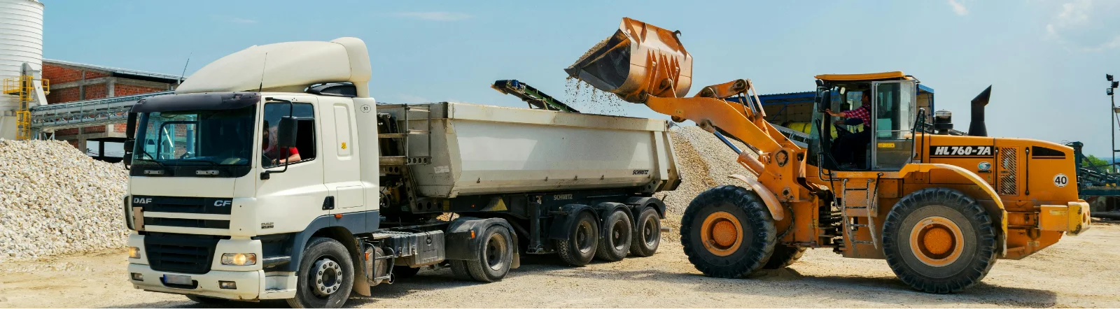 Construction trucks doing work